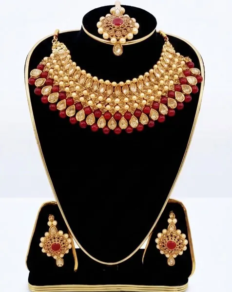 Regal Crimson & Gold Kundan Jewelry Set includes a statement choker matching drop earrings, and a coordinated maang tikka.