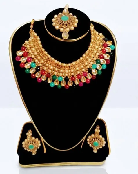Royal Kundan-Style Multicolored Choker Jewelry Set includes a statement choker matching drop earrings, and a coordinated maang tikka. thumbnail